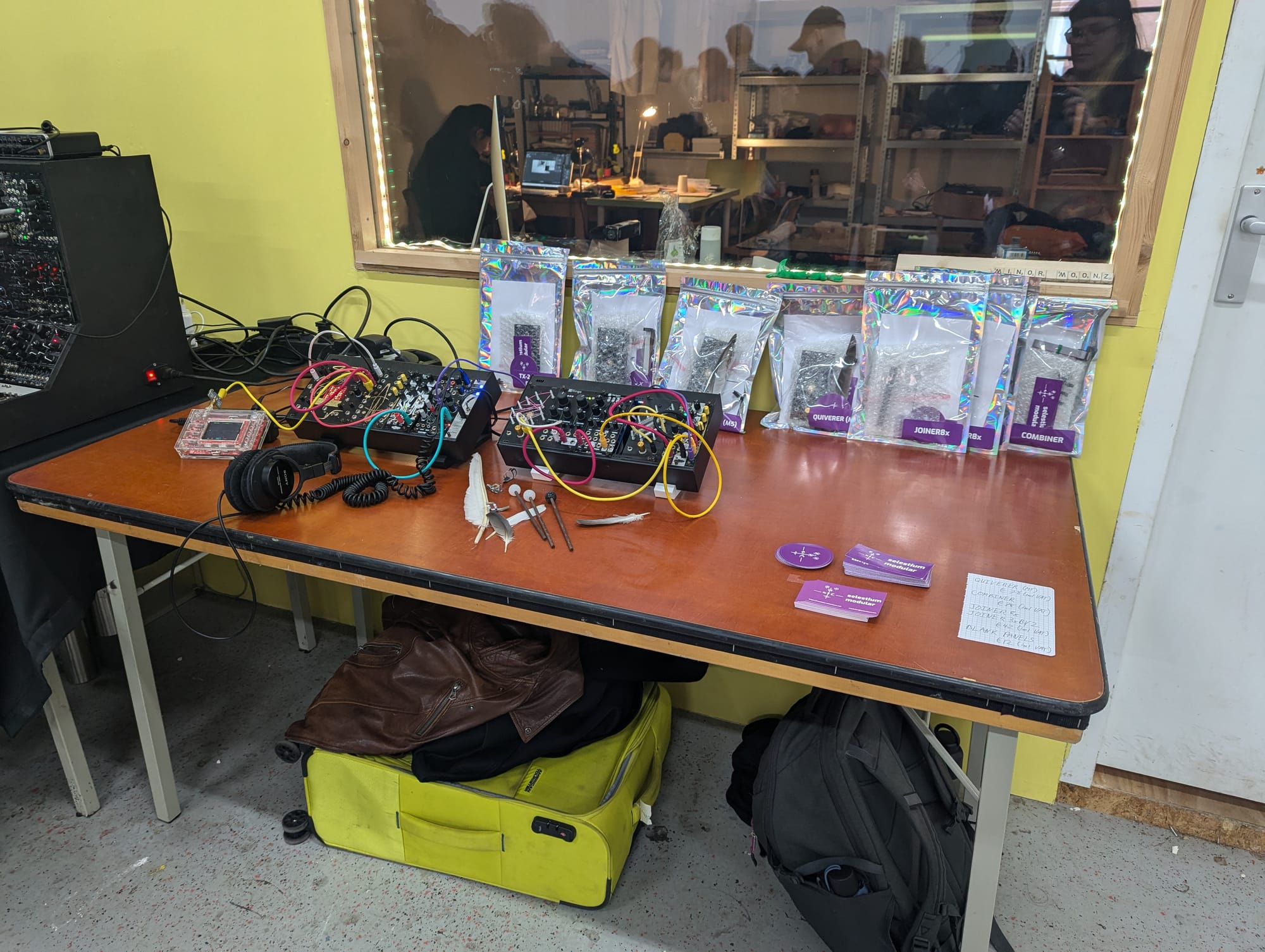 Simple table for selestium modular at Ginko Modular Fest showing some synthesizers with my modules a series of bags of available modules.